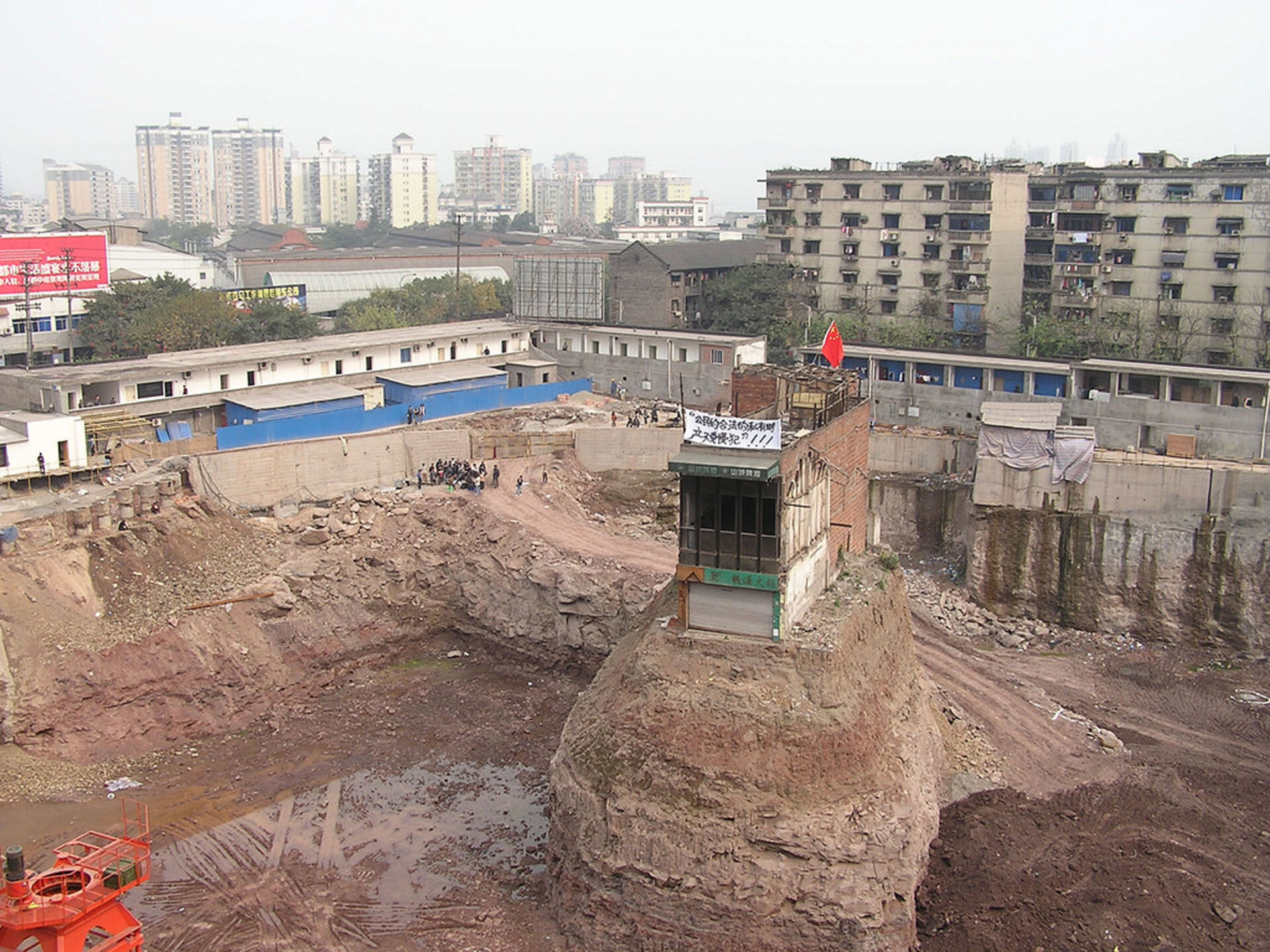 The famous Nail House in Chongqing remained isolated within the construction site, 2007.