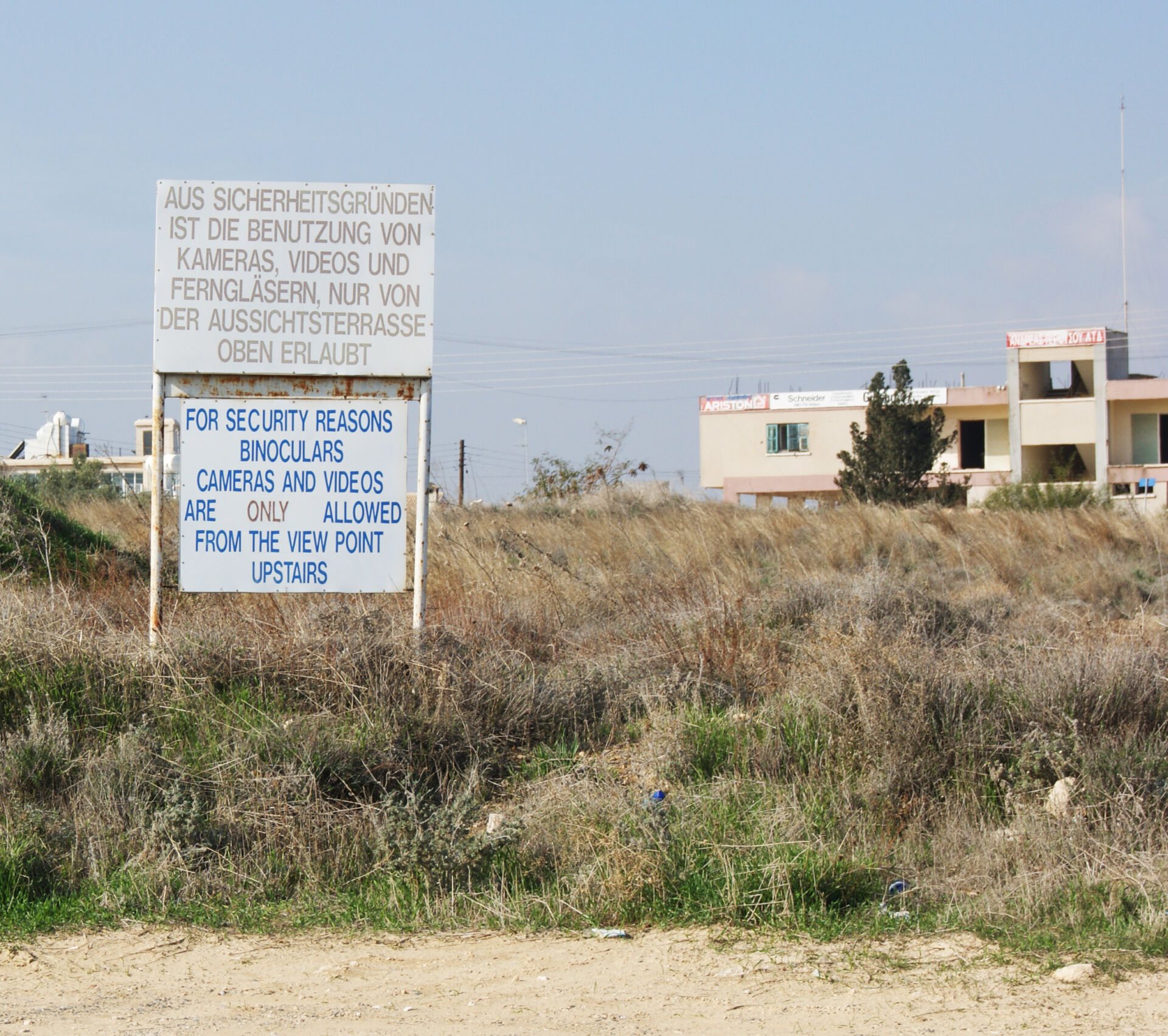UN prohibition signage on the border nearby Varosha. For photography, that was also prohibited from the street the advice was to use one of the improvised viewpoints that locals created on their rooftops.