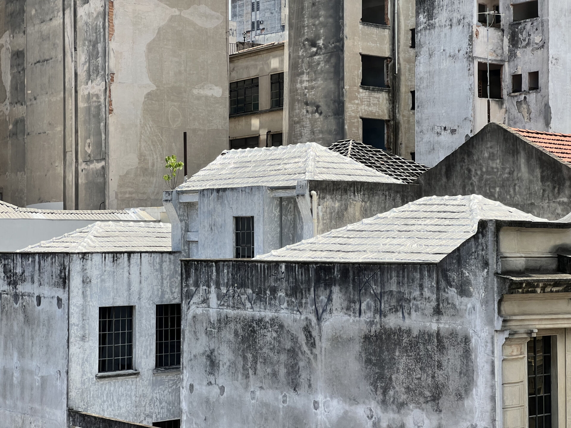 Membrane over roofs in São Paulo, Brazil to simplify repair work of localized leaks. Photo by author.